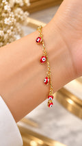 Pulsera Ojitos rojos Oro Laminado