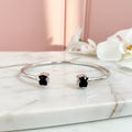 Brazalete doble oso con Onix facetado baño de rodio